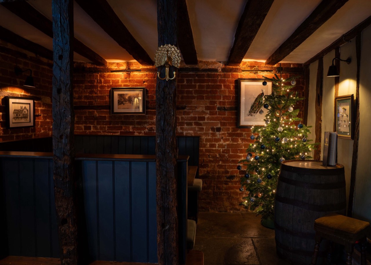 A candlelit private dining setting at The Peacock Inn