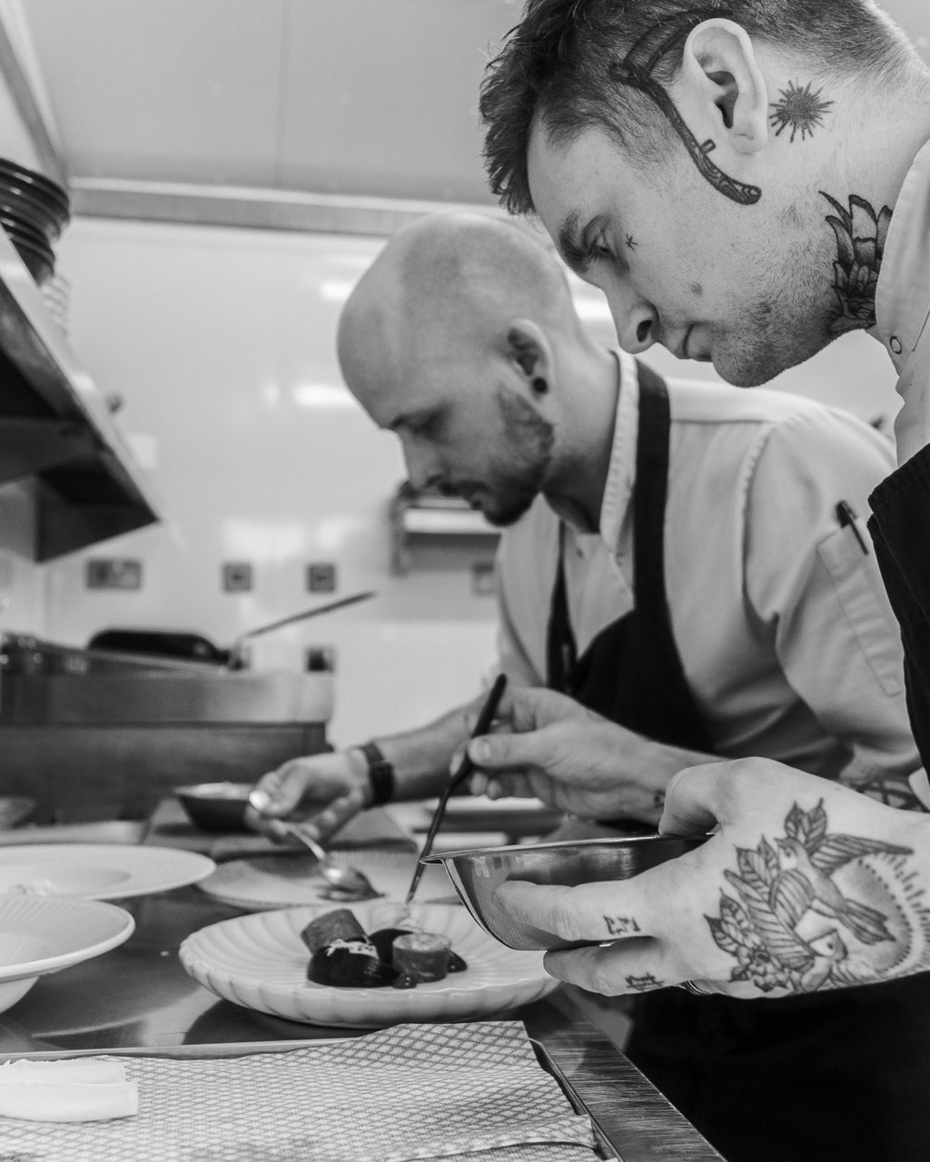 The team at work in the kitchen, in black and white